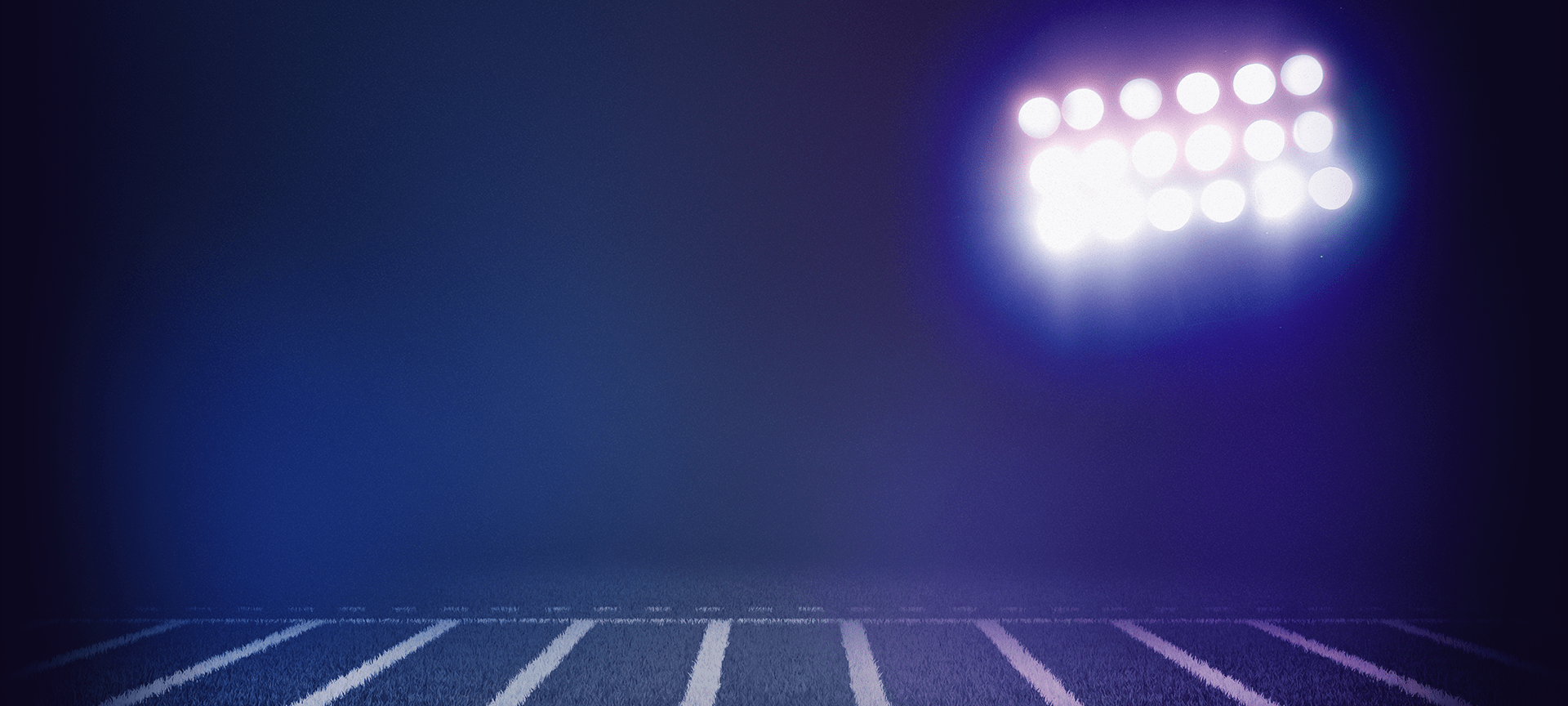 Background of football field with stadium lights illuminating it